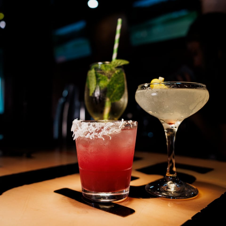 Three colorful cocktails arranged on the Tequila Bar counter.