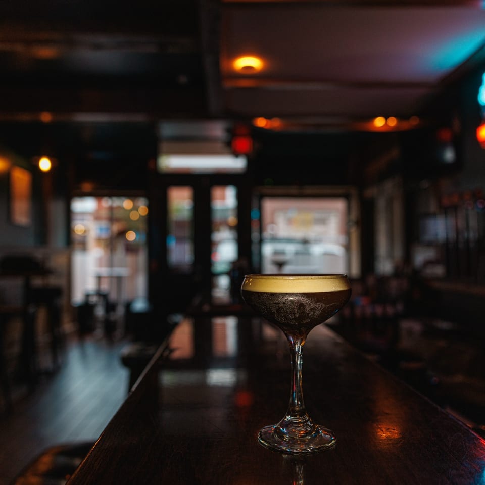 Espresso martini with the Espresso Bar interior in the background.