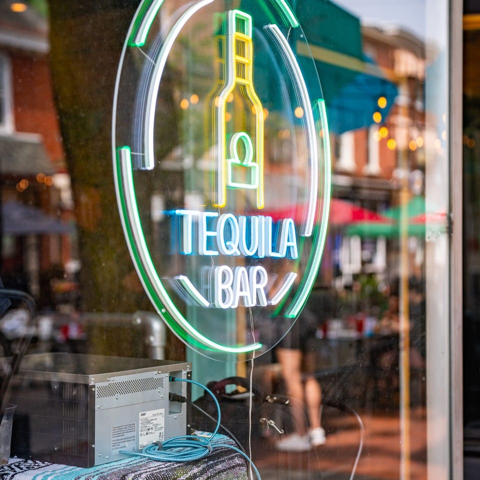 Tequila Bar neon sign in the window.