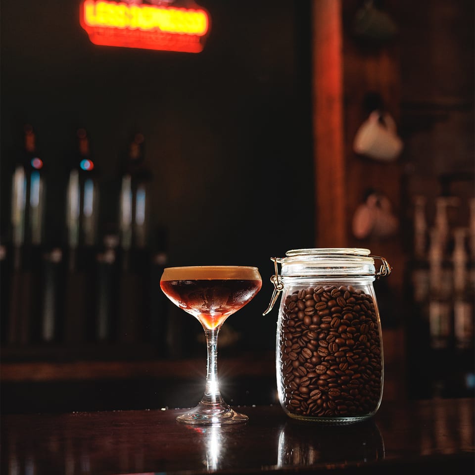 Espresso cocktail and coffee beans at the bar.